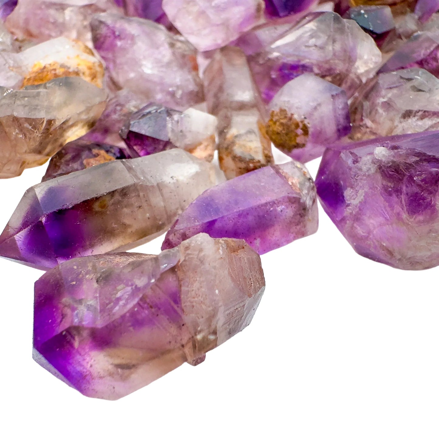 Near view of Smoky Amethyst raw point, showing natural variation.