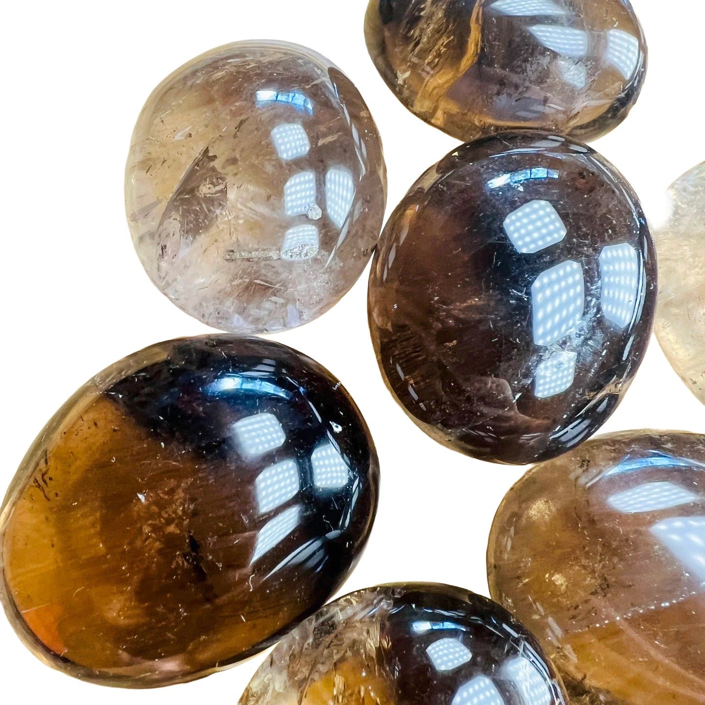 Edge view of Grade AA Smoky Quartz palm stone, Madagascar-sourced.