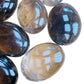 Bird's-eye view of Grade AA Smoky Quartz palm stone, often worked with for Grounding, sourced from Alaotra-Mangoro, Madagascar.