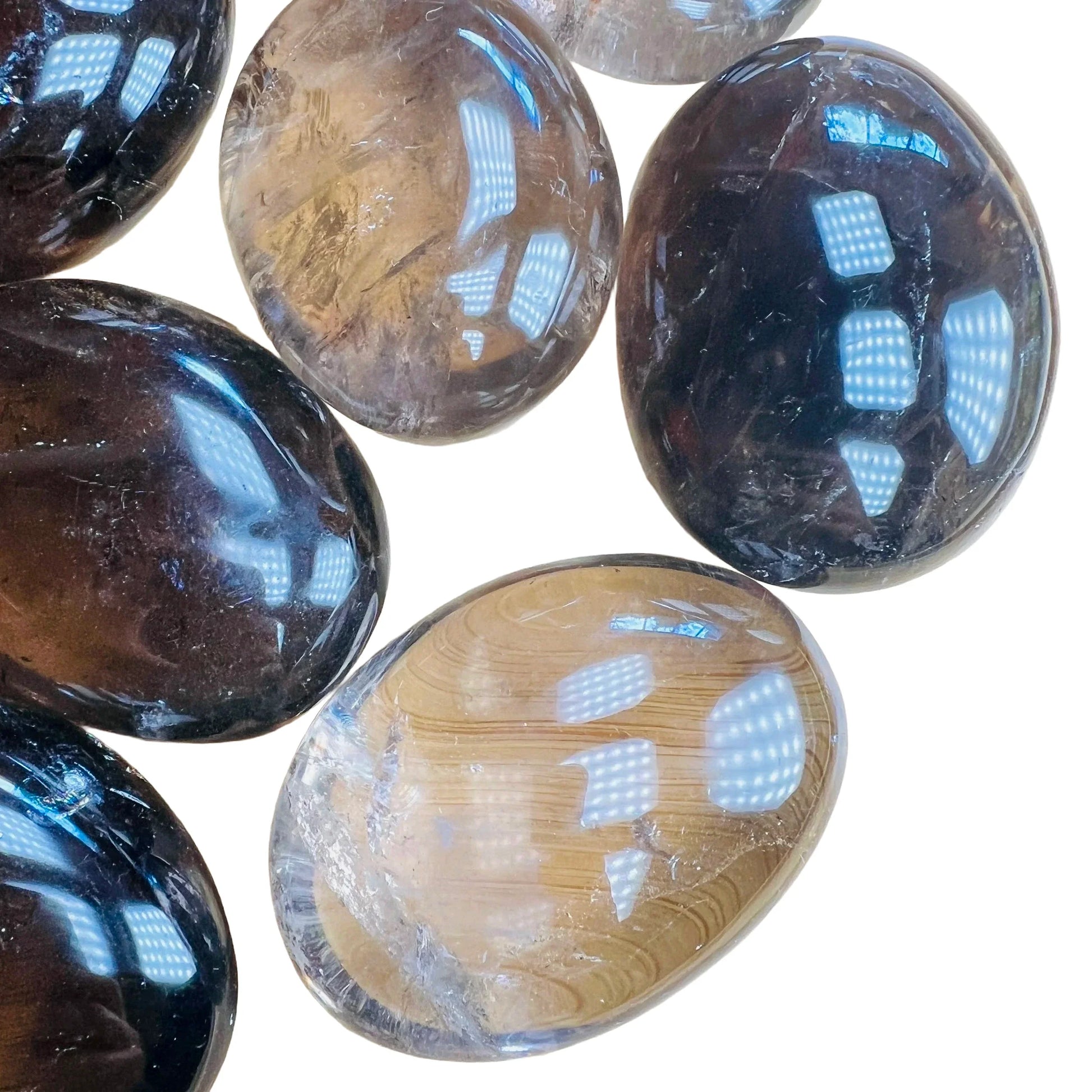 Bird's-eye view of Grade AA Smoky Quartz palm stone, often worked with for Grounding, sourced from Alaotra-Mangoro, Madagascar.