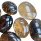 Reverse side of Smoky Quartz palm stone, showing earthy tone.