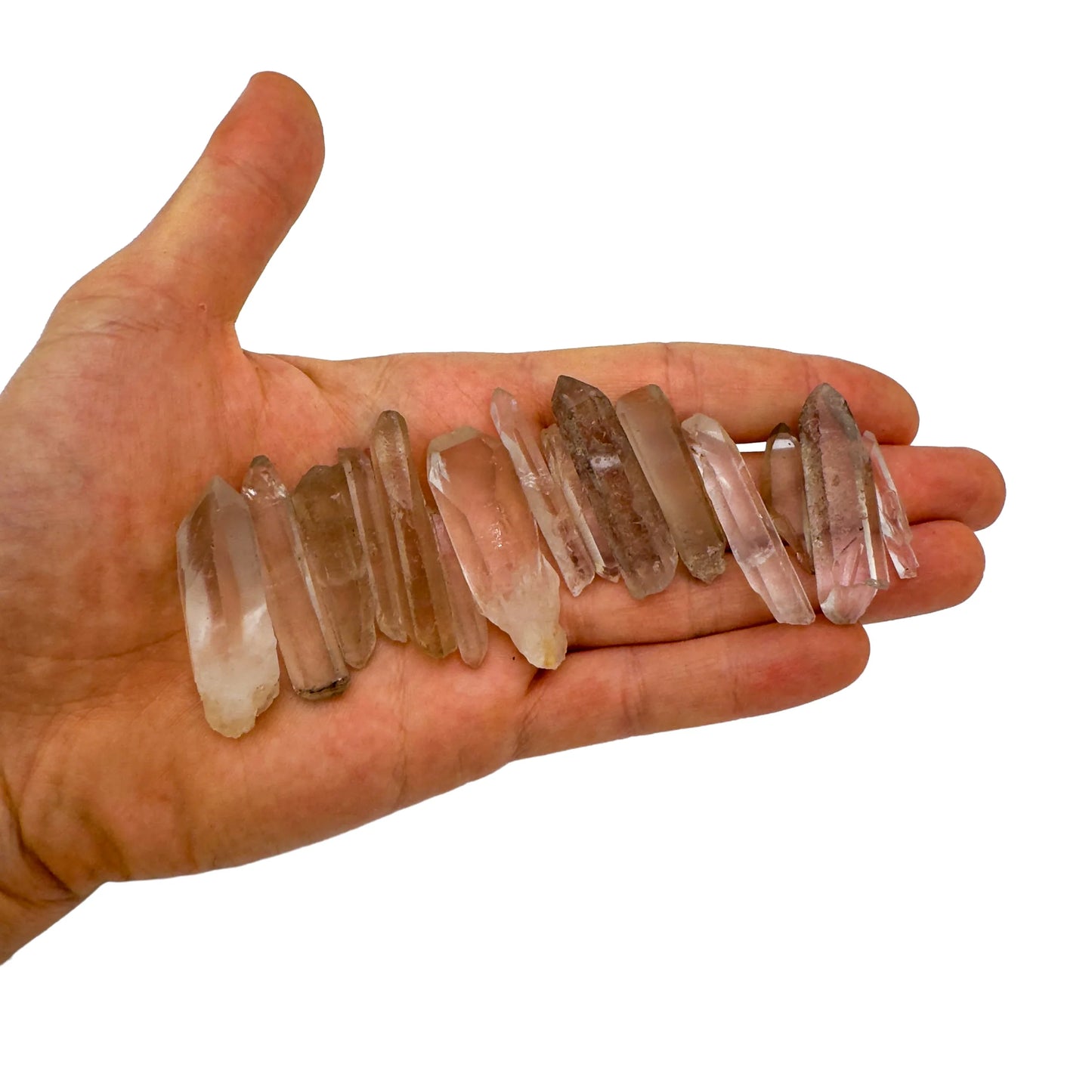 On a soft surface rests a Smoky Quartz raw crystal, from Minas Gerais, Brazil, often kept for Protection, with character of the piece on display.