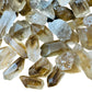 Macro view of Grade AA Smoky Quartz raw point, sourced from Brazil.