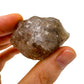 Detail shot of Grade AA Smoky Quartz raw under natural light