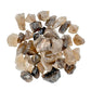 Surface detail of Smoky Quartz raw stone, sourced from Alaotra-Mangoro, Madagascar.