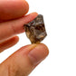 Held in palm of a Smoky Quartz raw crystal, from Alaotra-Mangoro, Madagascar, showing the piece in repose.