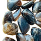 Side profile of Smoky Quartz tumbled stone, sourced from Madagascar, worked with for Grounding.