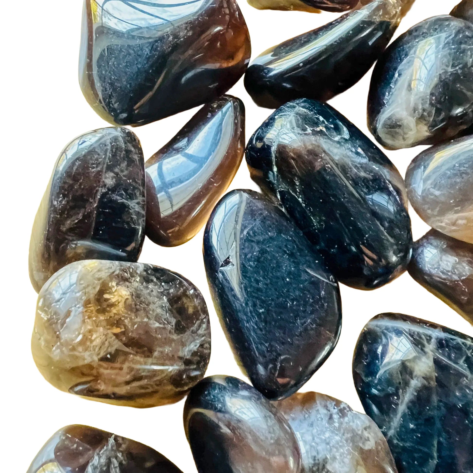 Side profile of Smoky Quartz tumbled stone, sourced from Madagascar, worked with for Grounding.