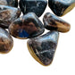 Detail capture of Smoky Quartz tumbled stone, traditionally used for Grounding, Madagascar-sourced.