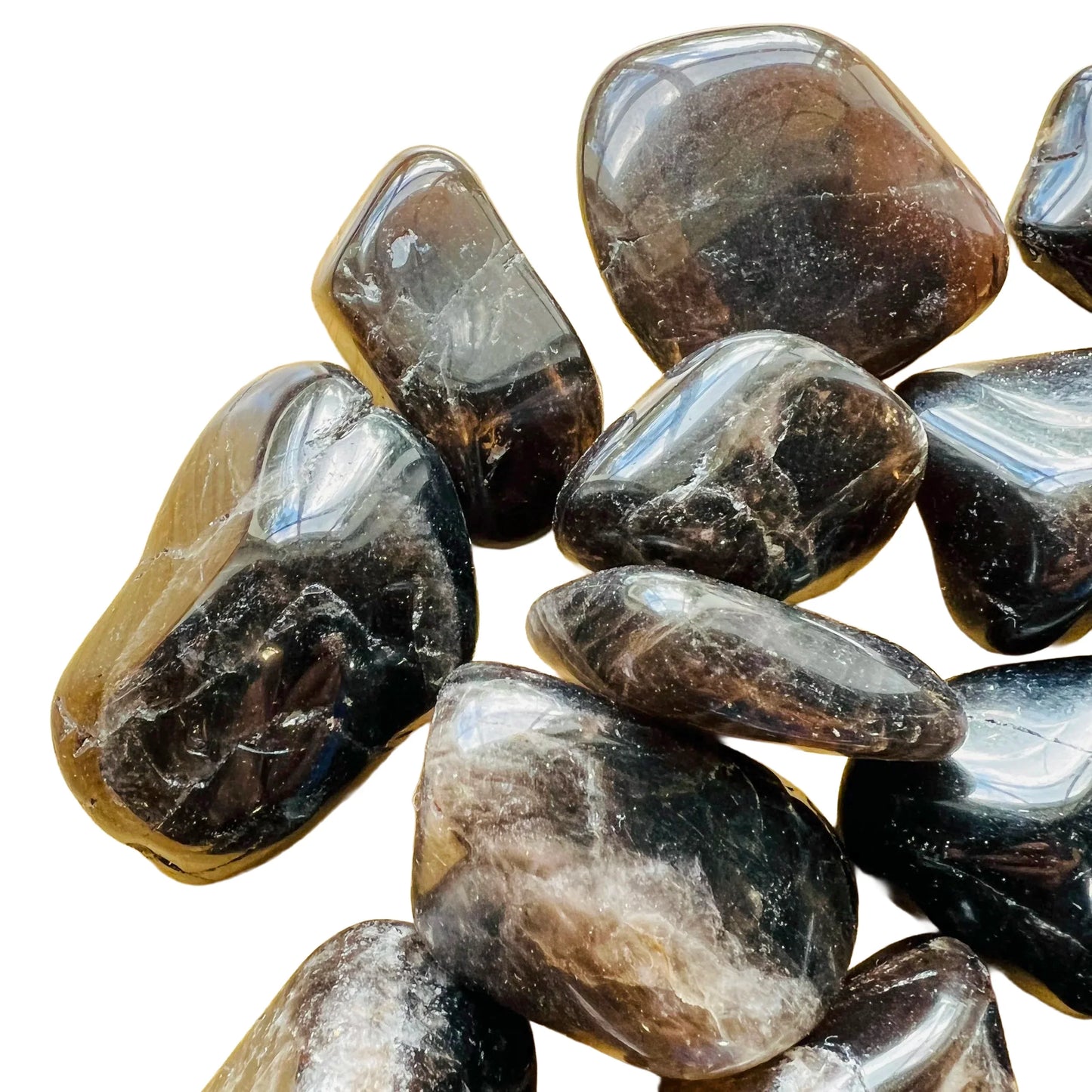 Overhead view of Grade AA Smoky Quartz tumbled stone, hand-selected from Vakinankaratra, Madagascar.