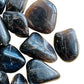 Reverse side of Smoky Quartz tumbled stone, sourced from Madagascar, showing natural texture.