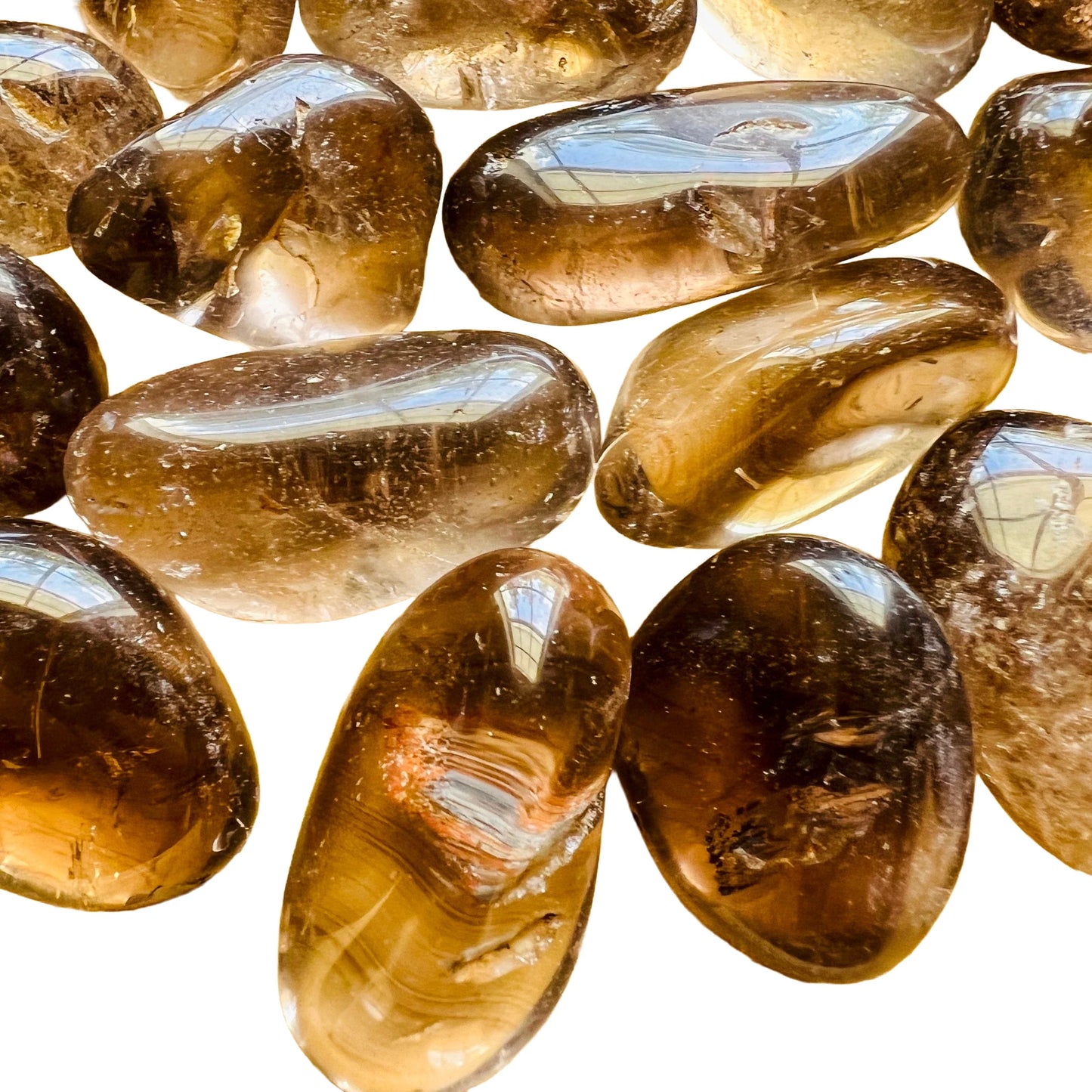 Edge view of Smoky Quartz tumbled stone, showing characteristic color, sourced from Brazil.