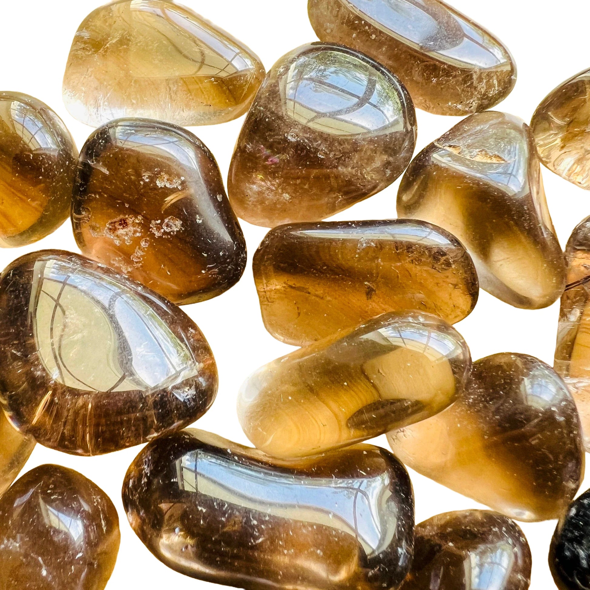Detail shot of Grade AAA Smoky Quartz tumbled stone under natural light