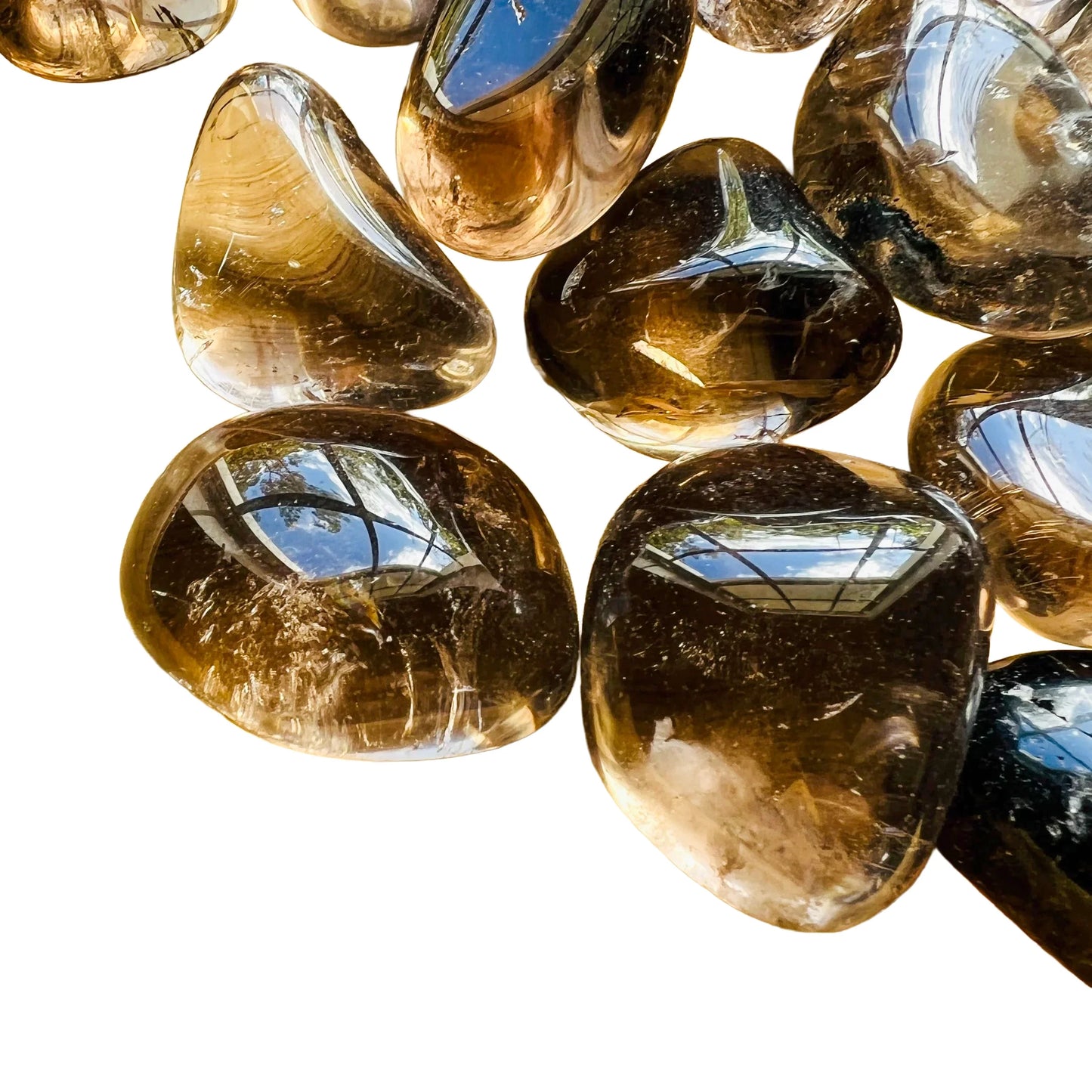 Close detail of Smoky Quartz tumbled stone, kept close for Grounding and Protection, sourced from Brazil.