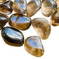 Overhead angle of Smoky Quartz tumbled stone, showing subtle veining.