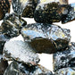 Reverse side of Snowflake Obsidian raw stone, hand-selected from Utah, United States, kept near for Grounding.