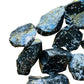 Grade aa snowflake obsidian raw held in hand for size reference