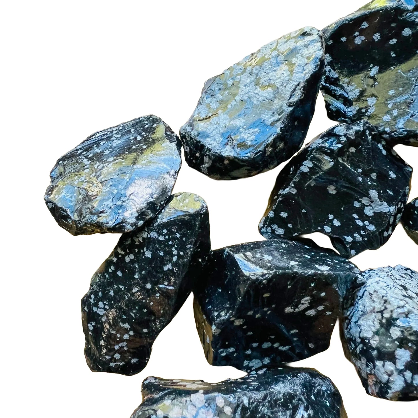 Grade aa snowflake obsidian raw held in hand for size reference