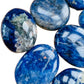 Edge-on view of Grade AA Sodalite palm stone, from Namibia.