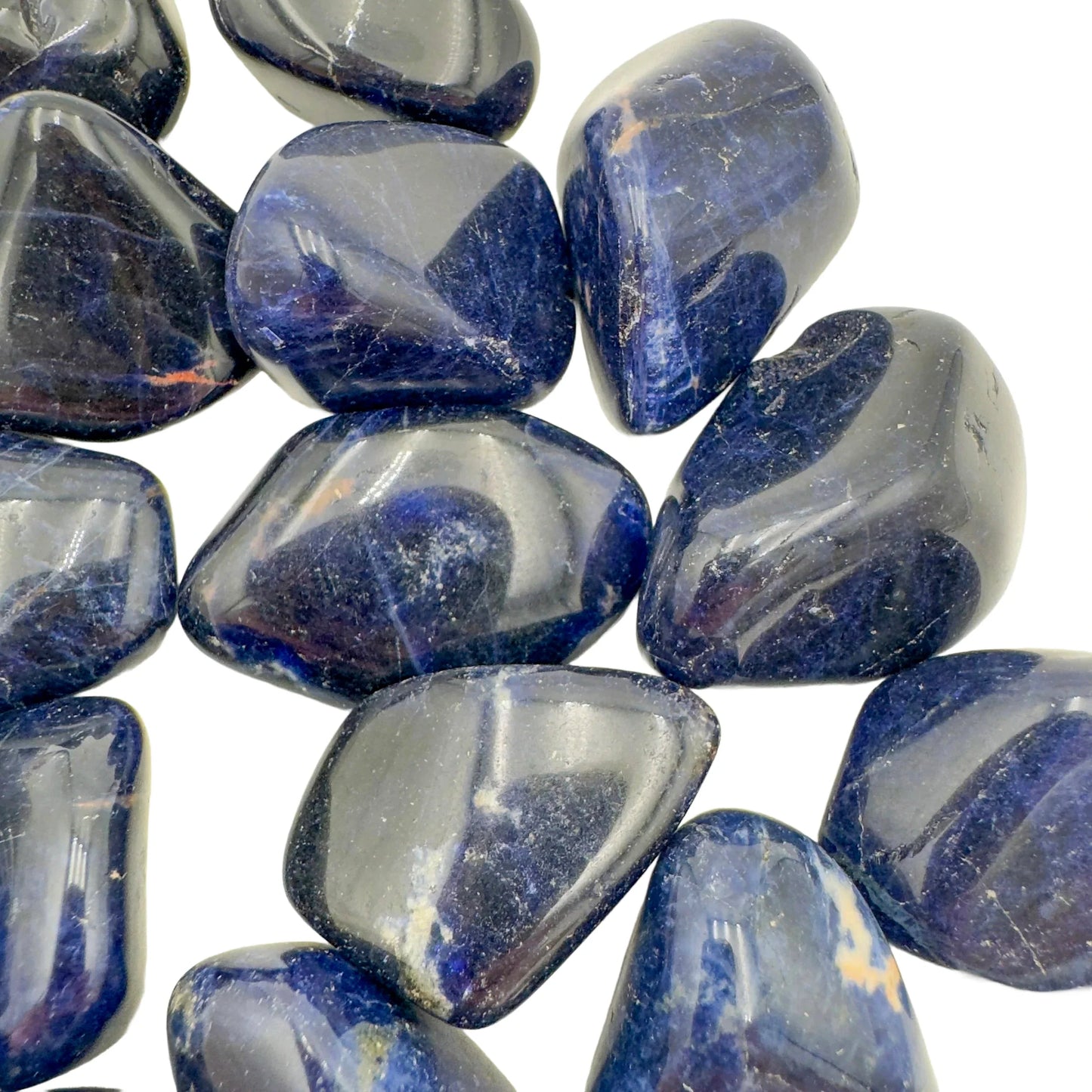 Hand-held view of a single Sodalite tumbled stone Namibia-sourced, from Namibia.