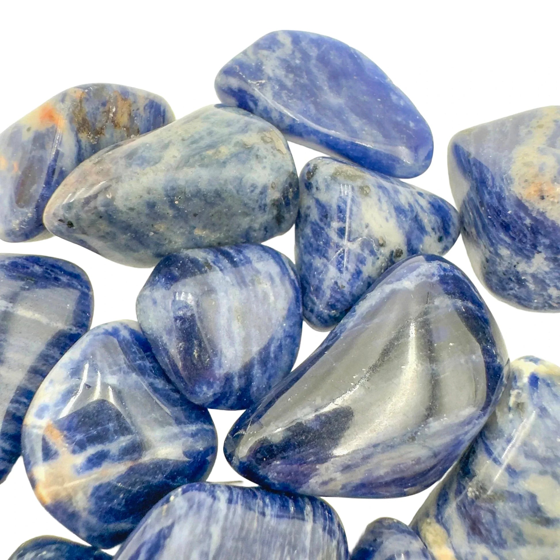 Tabletop view of Sodalite tumbled stone, from Kunene, Namibia, often kept for Meditation, with natural details visible.