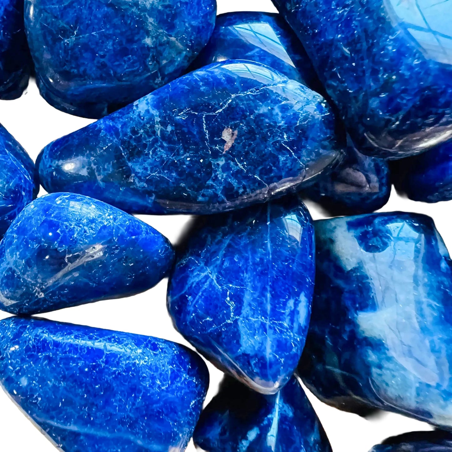 Top-down shot of Sodalite tumbled stone, showing color depth, from Namibia.