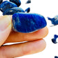 Whole-piece view of Sodalite tumbled stone, from Kunene, Namibia, traditionally used for Intuition, shown in its everyday setting.