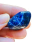 Back view of Grade AA Sodalite tumbled stone showing natural surface
