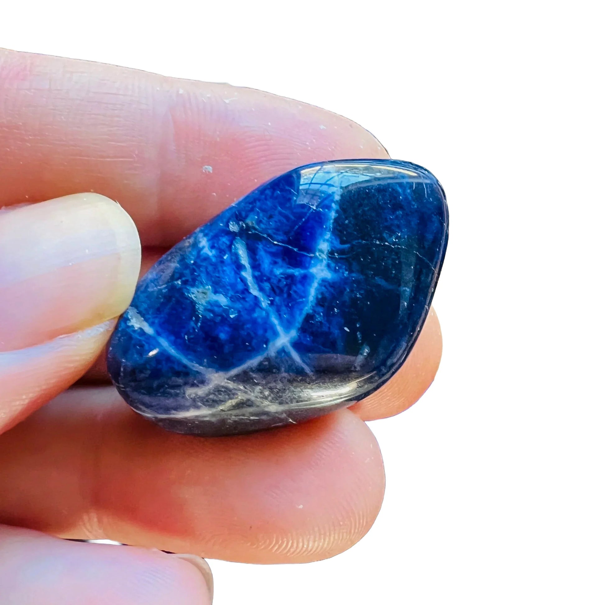 Back view of Grade AA Sodalite tumbled stone showing natural surface