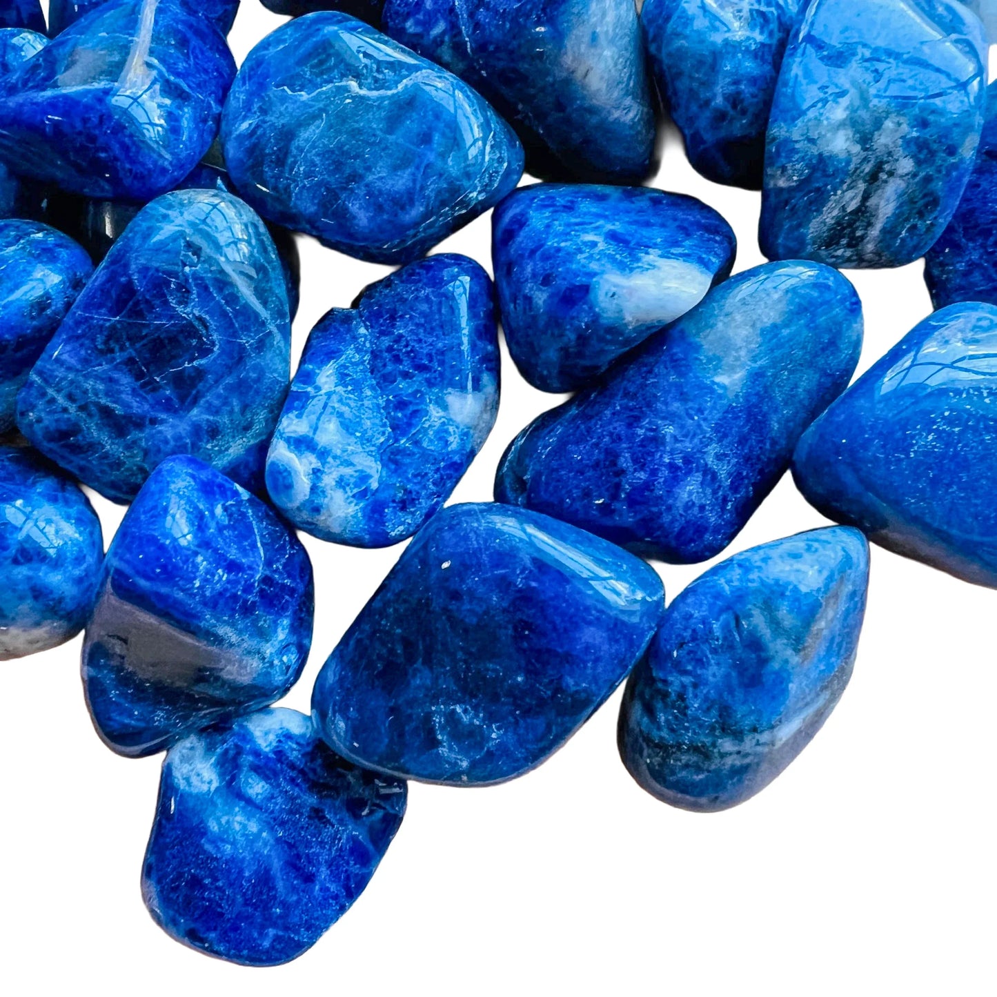 Surface detail of Sodalite tumbled stone, showing subtle veining, from Bahia, Brazil.