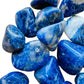 Overhead view of Grade A Sodalite tumbled stone, associated with Focus, showing characteristic color.