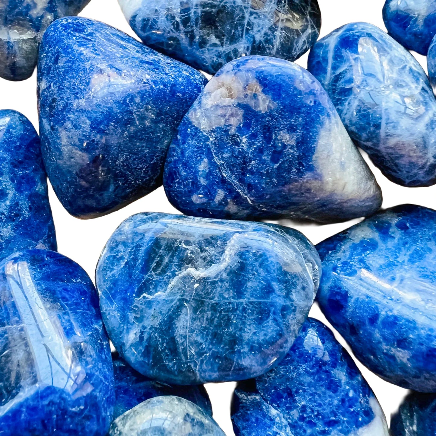 Reverse side of Sodalite tumbled stone, from Brazil, showing translucent edges.