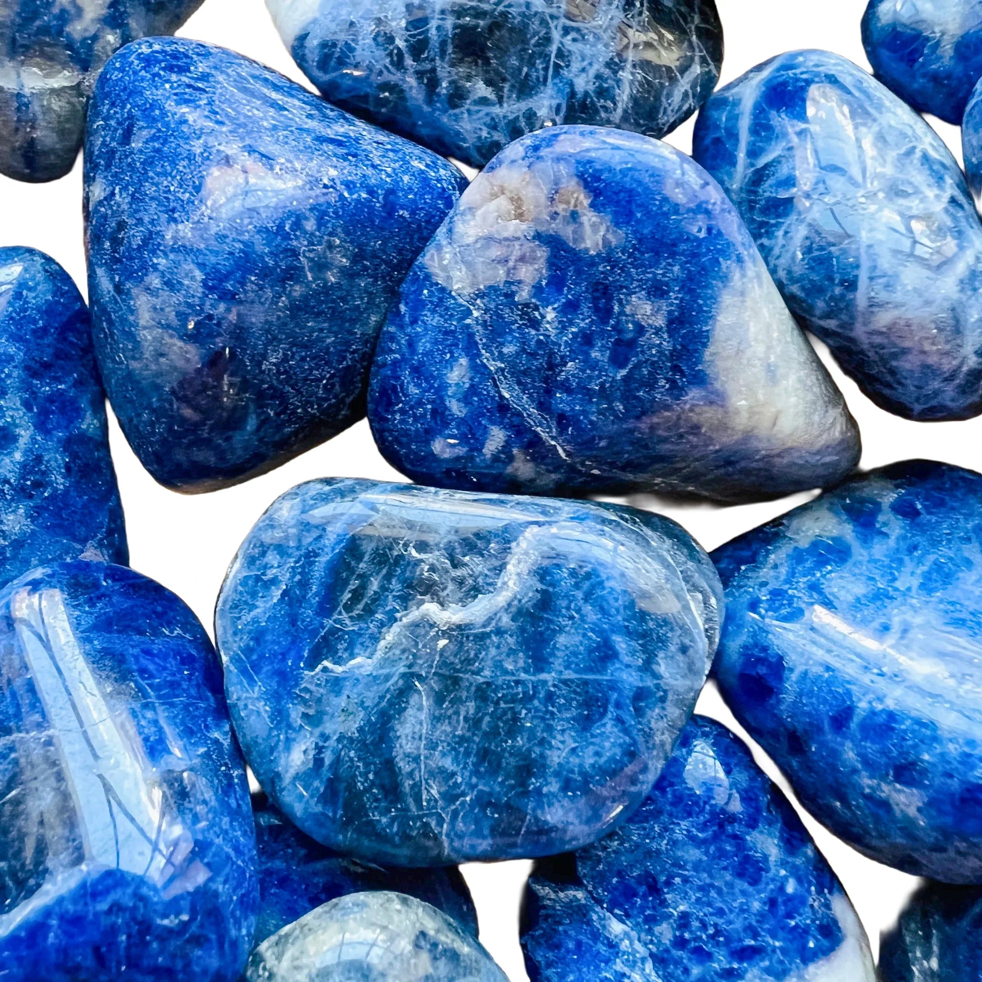 Reverse side of Sodalite tumbled stone, from Brazil, showing translucent edges.