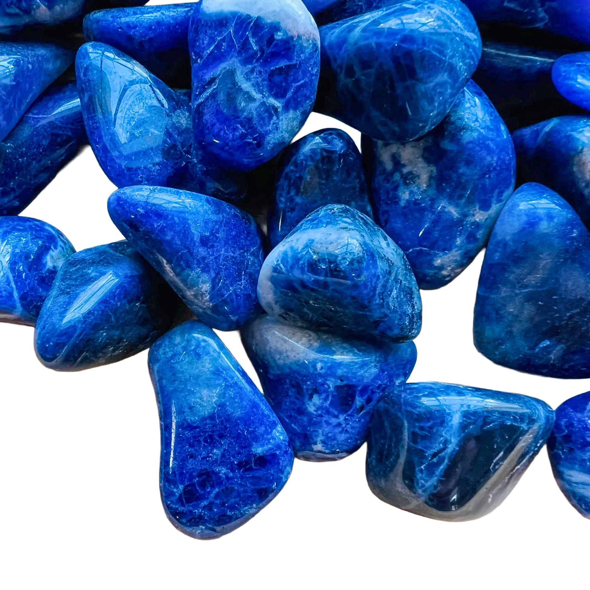 Side angle of Sodalite tumbled stone, hand-selected from Bahia, Brazil, showing natural variation.