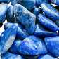 Underside detail of Sodalite tumbled stone, showing characteristic color.