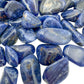 Side-on view of Sodalite tumbled stone, worked with for Focus, from Kunene, Namibia.