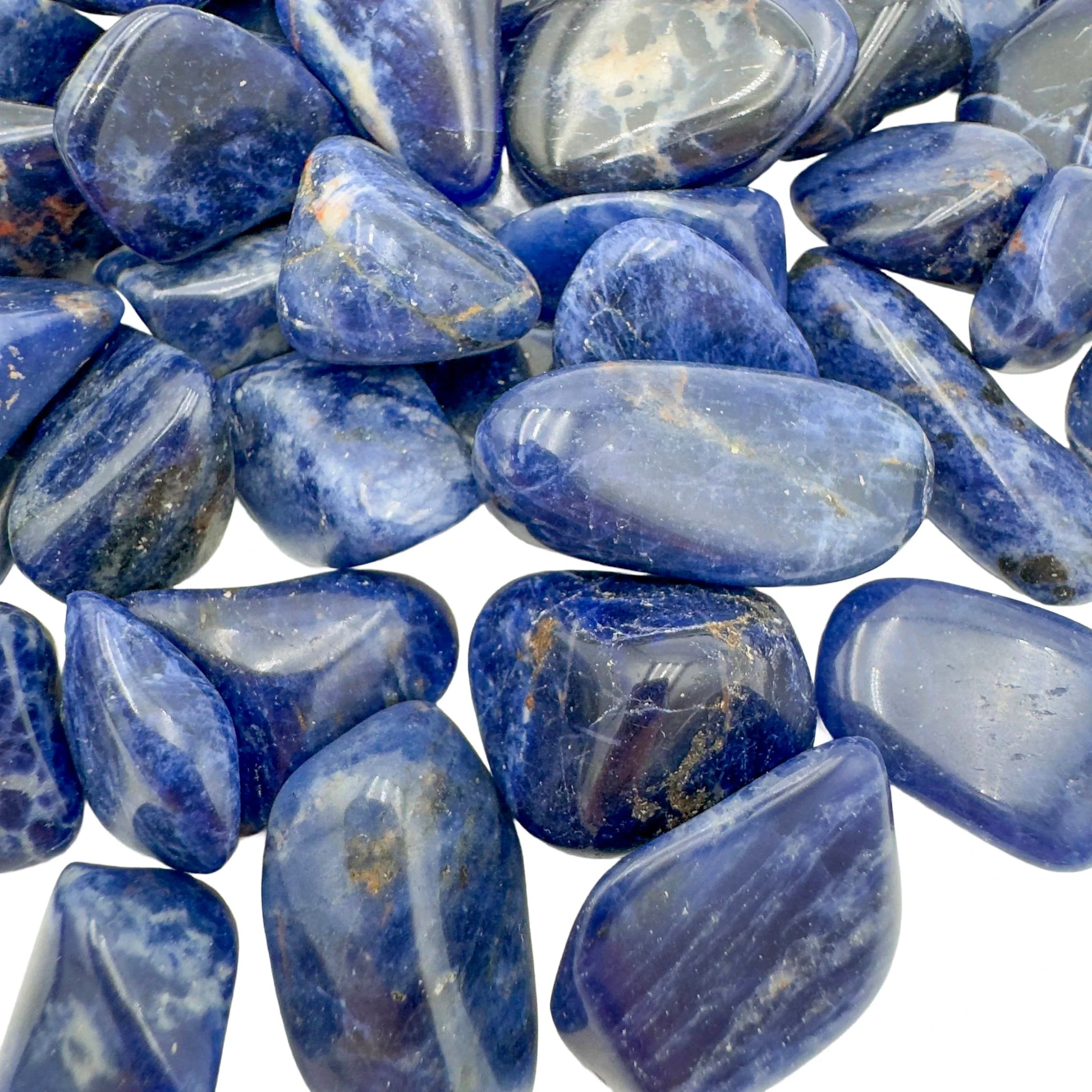 Side-on view of Sodalite tumbled stone, worked with for Focus, from Kunene, Namibia.