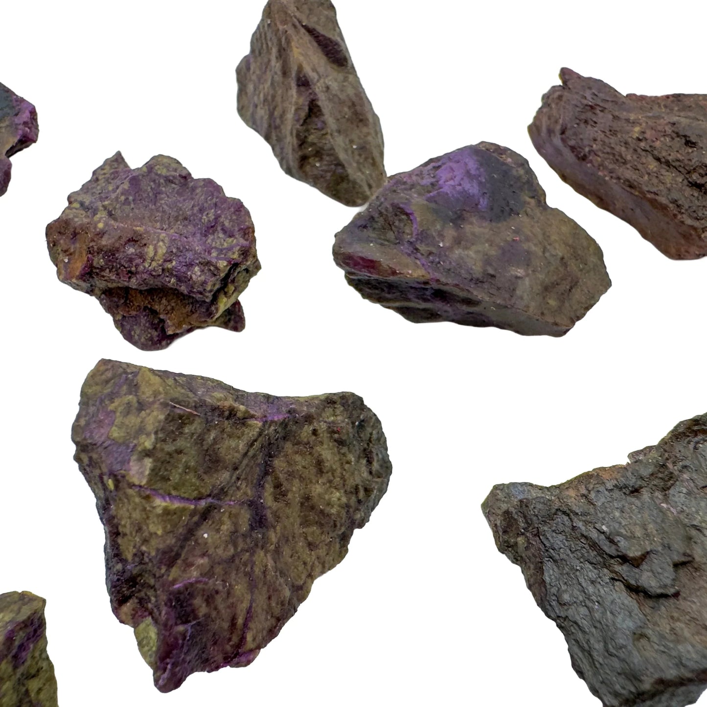 Lifestyle view of a Stichtite raw stone held against natural backdrop, hand-selected from Mpumalanga, South Africa.