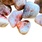 Macro view of Sunstone tumbled stone, for Confidence, showing natural variation.