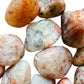 Plan view of Sunstone tumbled stone, from Morogoro, Tanzania, kept close for Confidence.