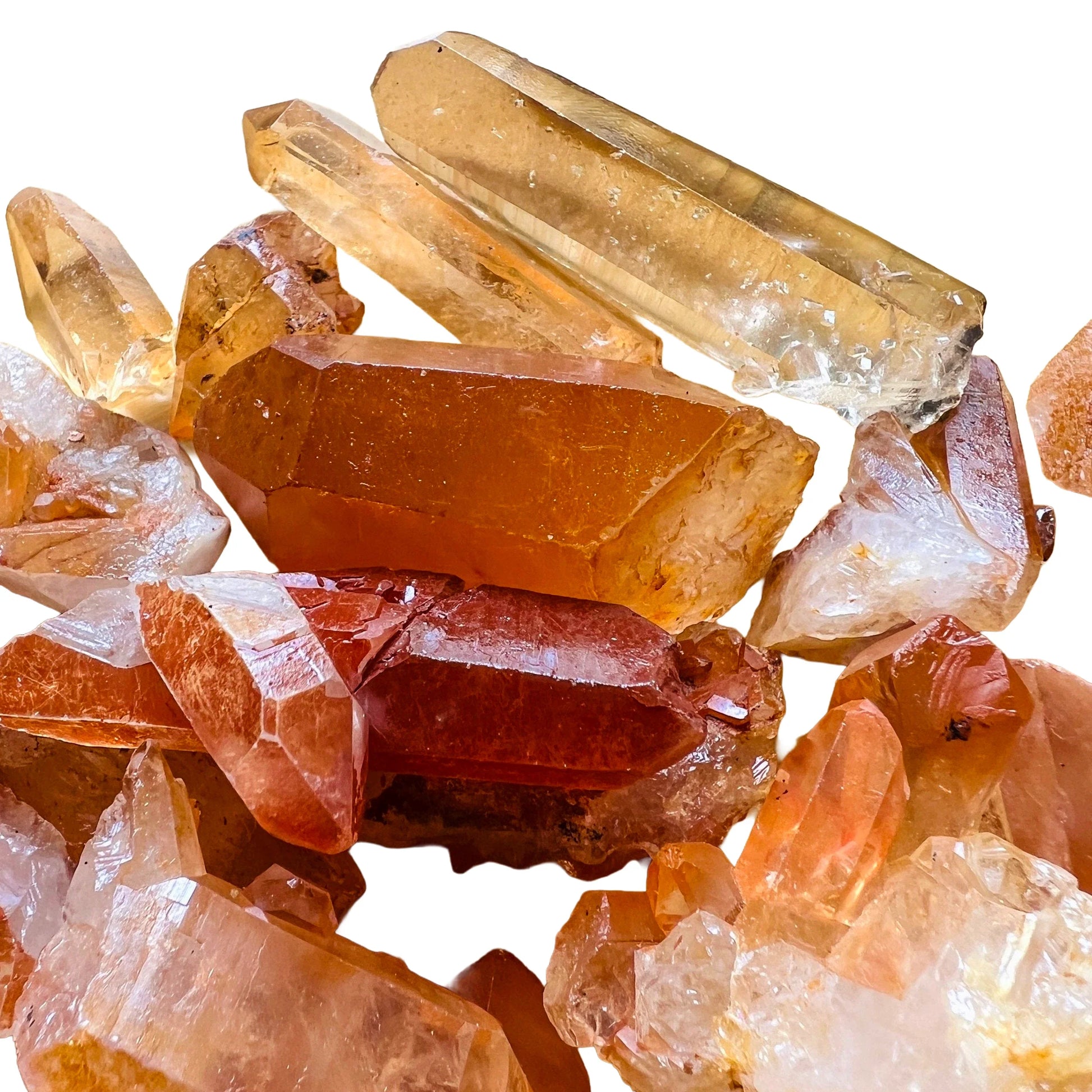 Palm-scale view of a Tangerine Quartz raw point, sourced from Brazil.