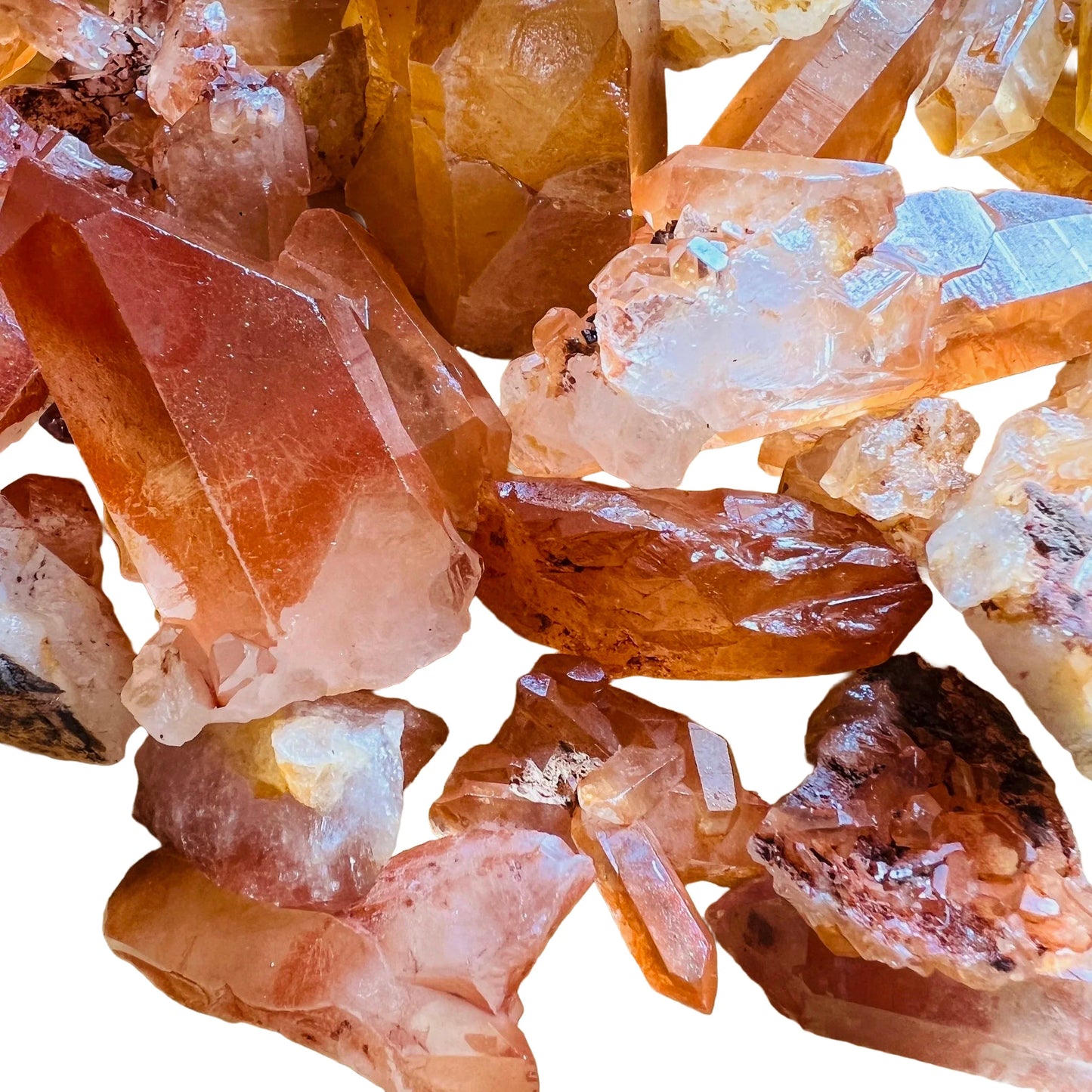 Grade aa tangerine quartz point held in hand for size reference