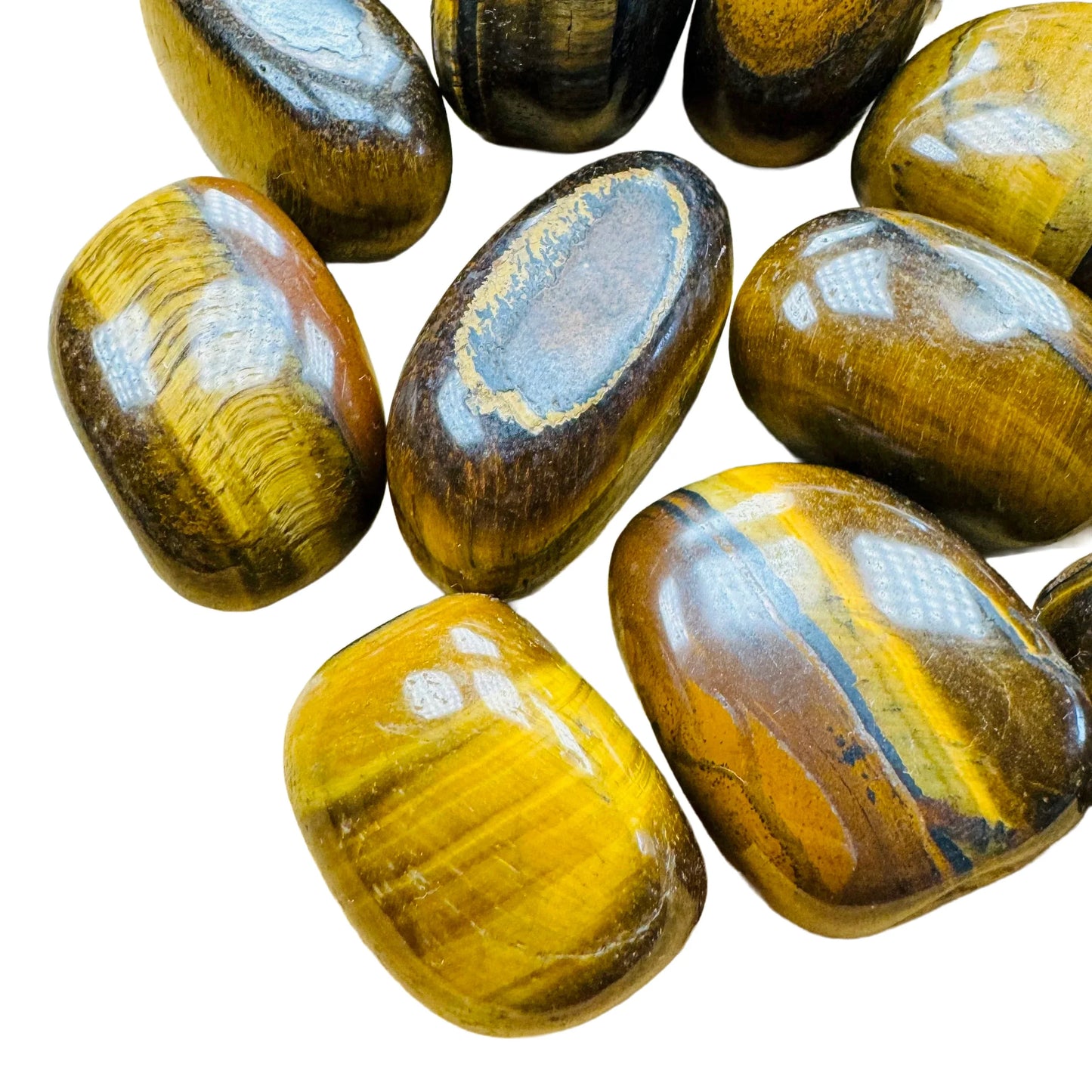Tight crop of Tiger Eye tumbled stone, showing characteristic color.