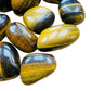 Side-on view of Grade AA Tiger Eye tumbled stone, hand-selected from Northern Cape, South Africa.