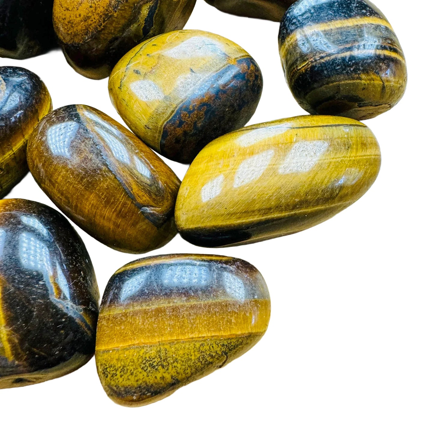 Side-on view of Grade AA Tiger Eye tumbled stone, hand-selected from Northern Cape, South Africa.