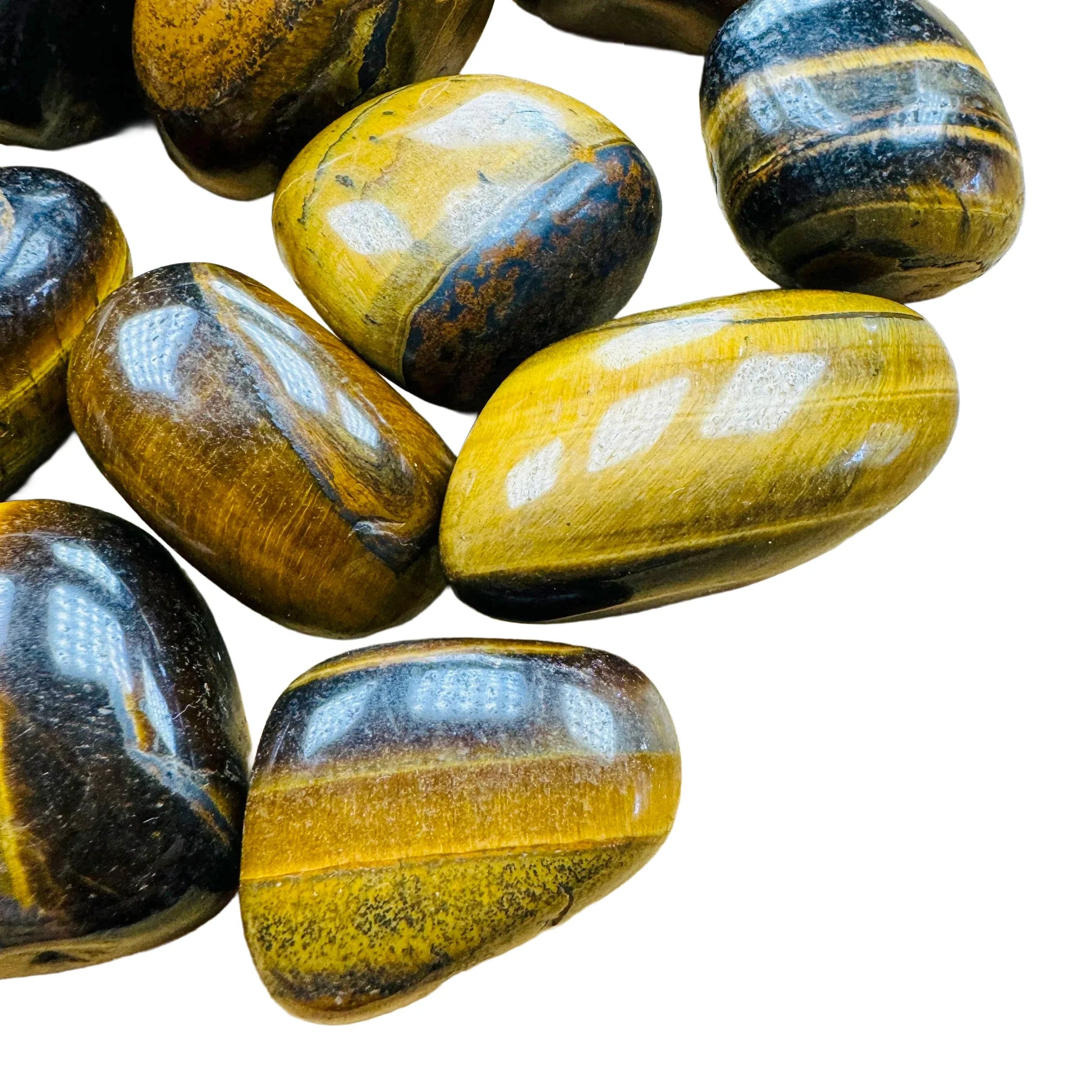 Side-on view of Grade AA Tiger Eye tumbled stone, hand-selected from Northern Cape, South Africa.