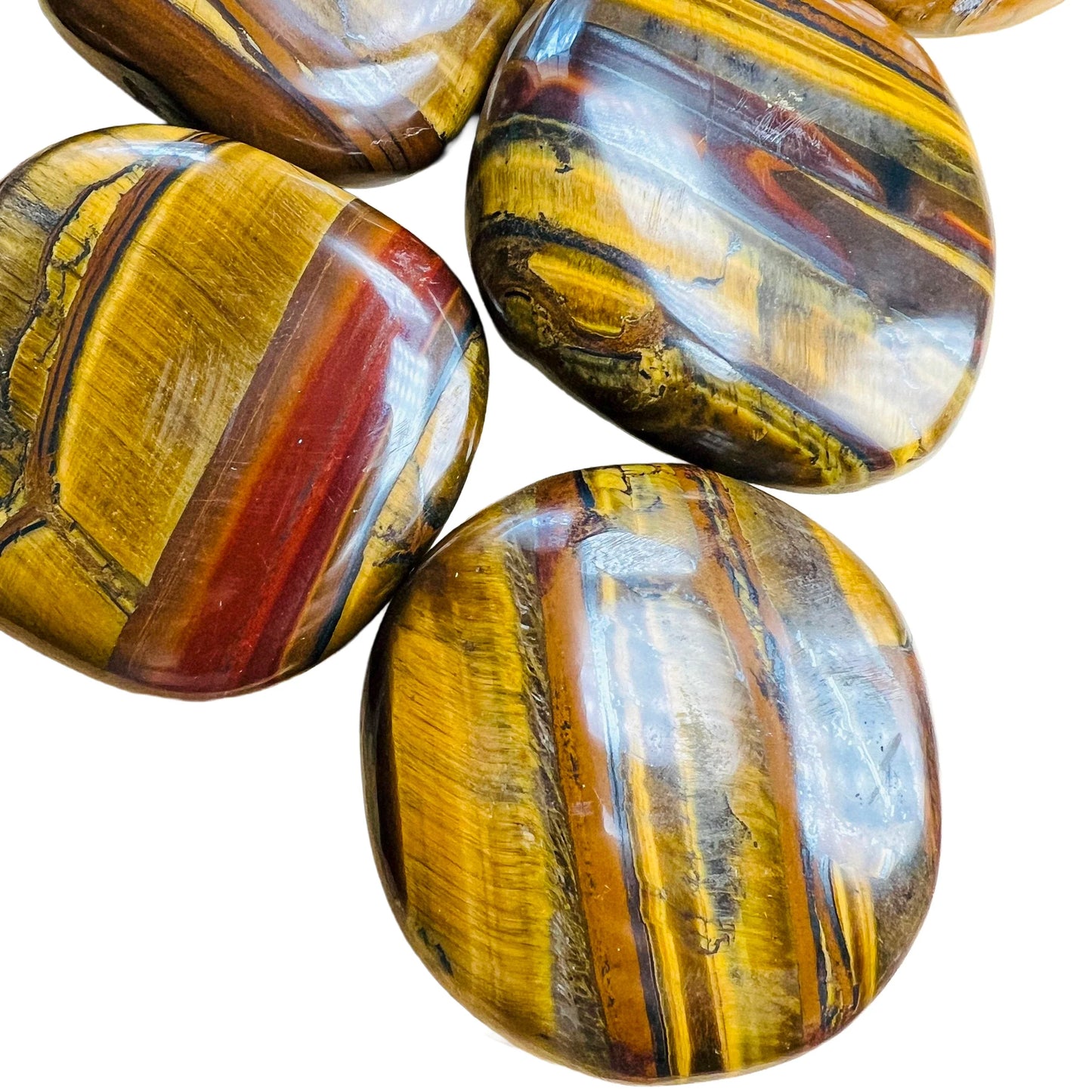 Plan view of Grade AA Tiger Eye palm stone, showing natural inclusions, South Africa-sourced.