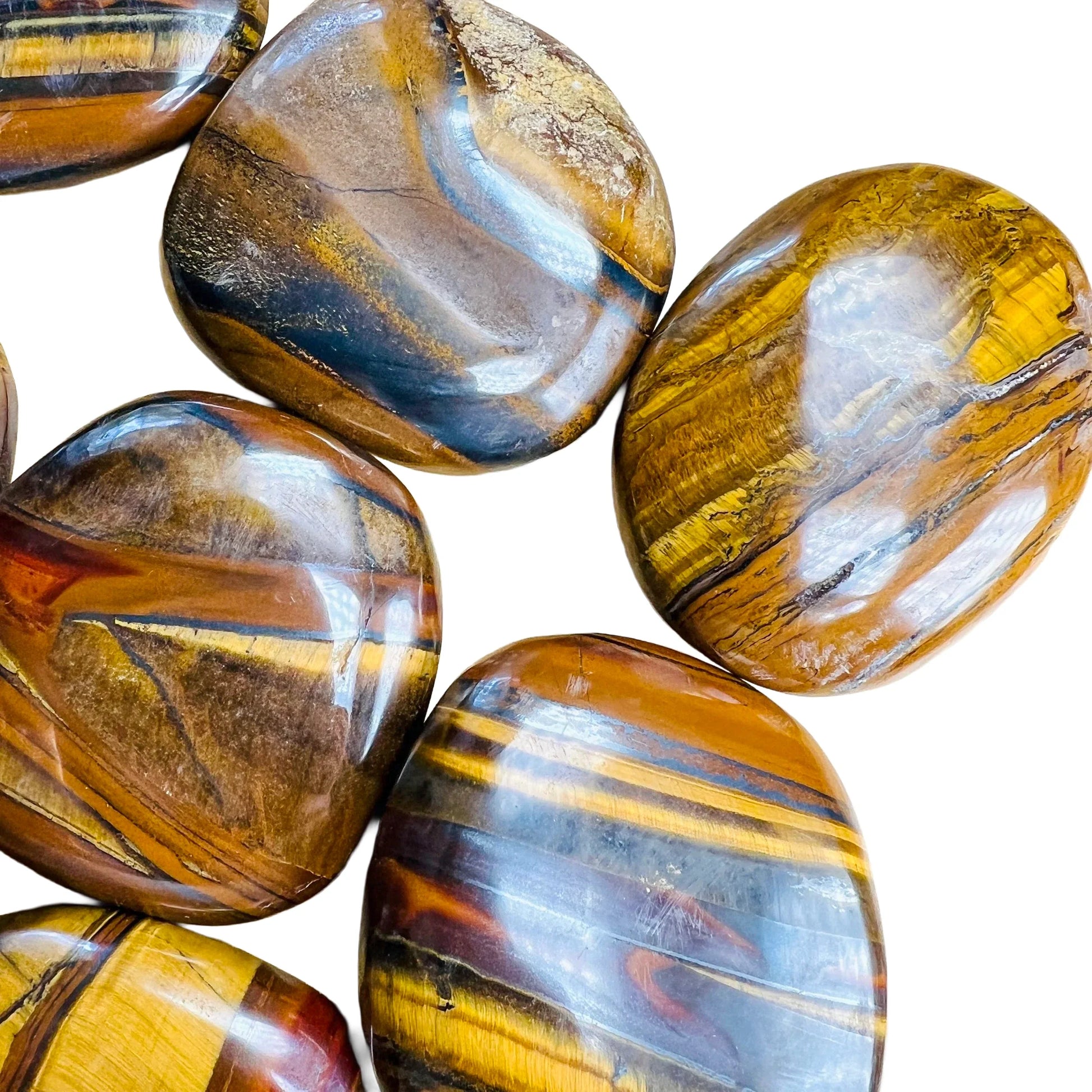 Underside view of brown Tiger Eye palm stone, often worked with for Confidence, sourced from South Africa.