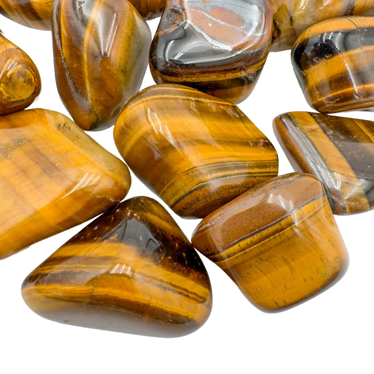 Side profile of Tiger Eye tumbled stone, sourced from Northern Cape, South Africa, worked with for Confidence.
