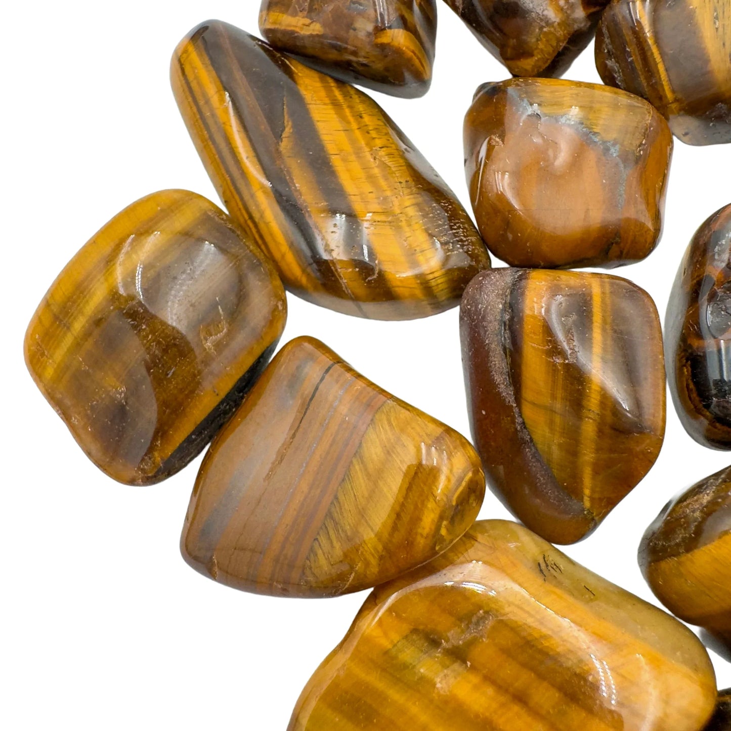 Bird's-eye view of Tiger Eye tumbled stone, from South Africa, showing natural sheen.